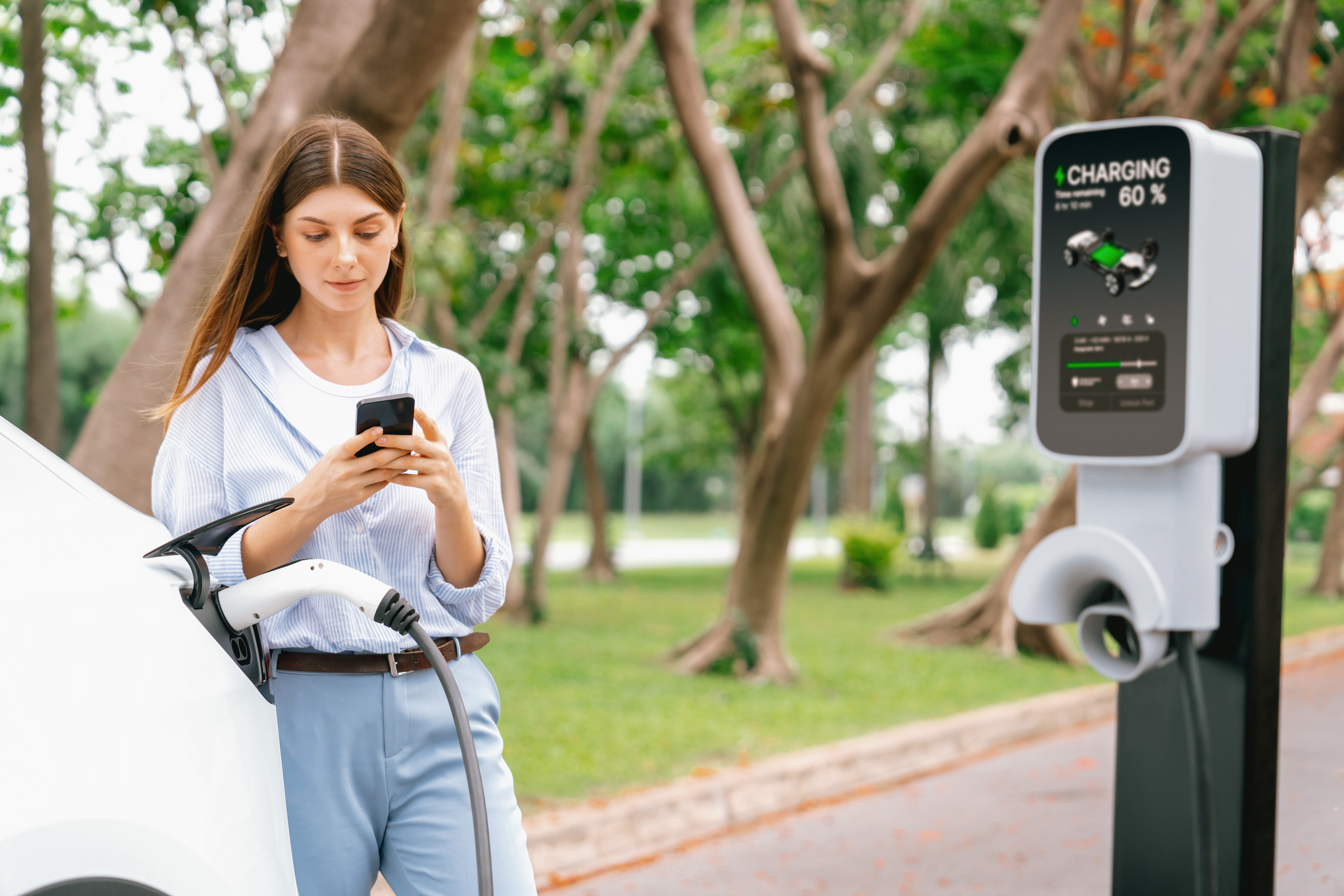A person using a mobile app to manage their smart home EV charger